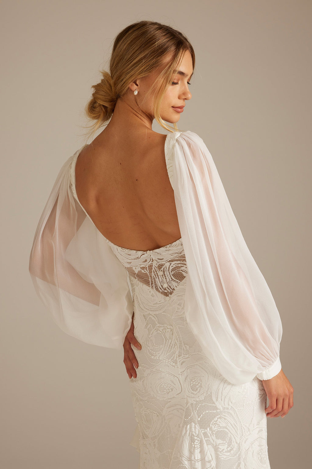 Back shot of Wedding Sleeve paired with Carmen Wedding Dress